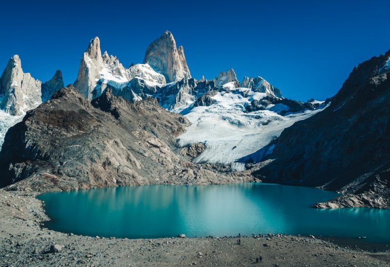 Snow-covered peaks above a turquoise glacial lake in Patagonia
