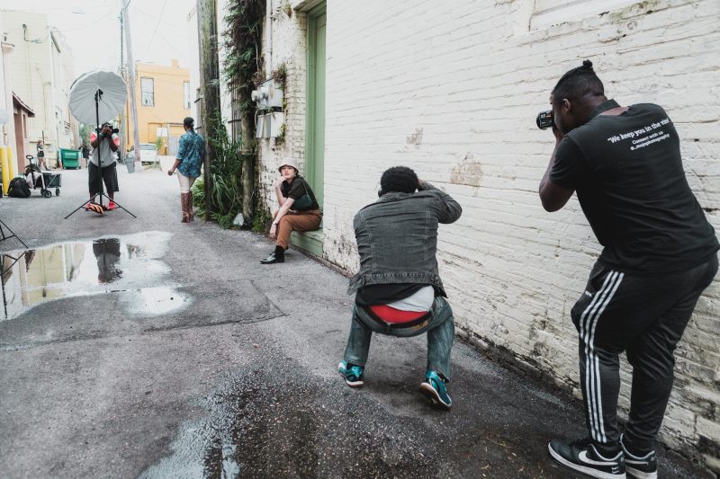 photographers in an alley taking photos of models