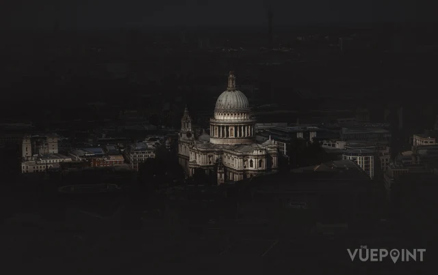 St Paul's Cathedral lit at night above a dark London skyline