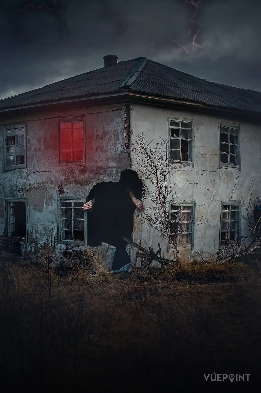 A derelict house at dusk with a figure at the door
