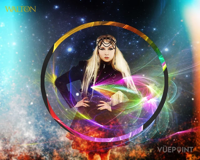 A figure inside a ring of coloured light against a starfield