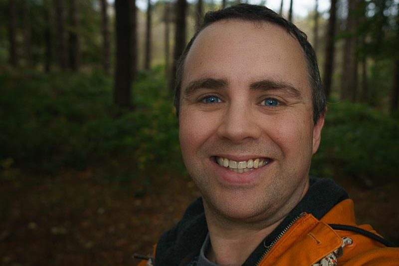 Photo of Stephen Walton, photography tutor and mentor at The VuePoint Photography. Close up photo of a selfie taken in a forest.