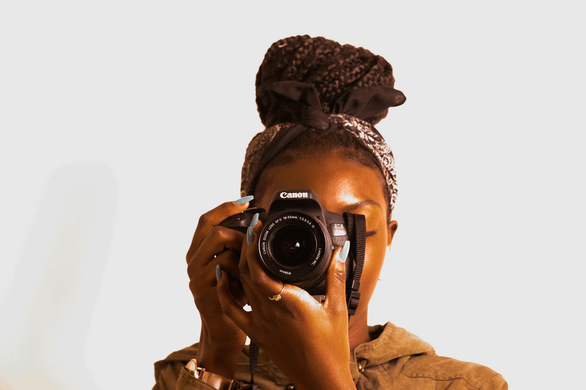 a black lady holding a camera