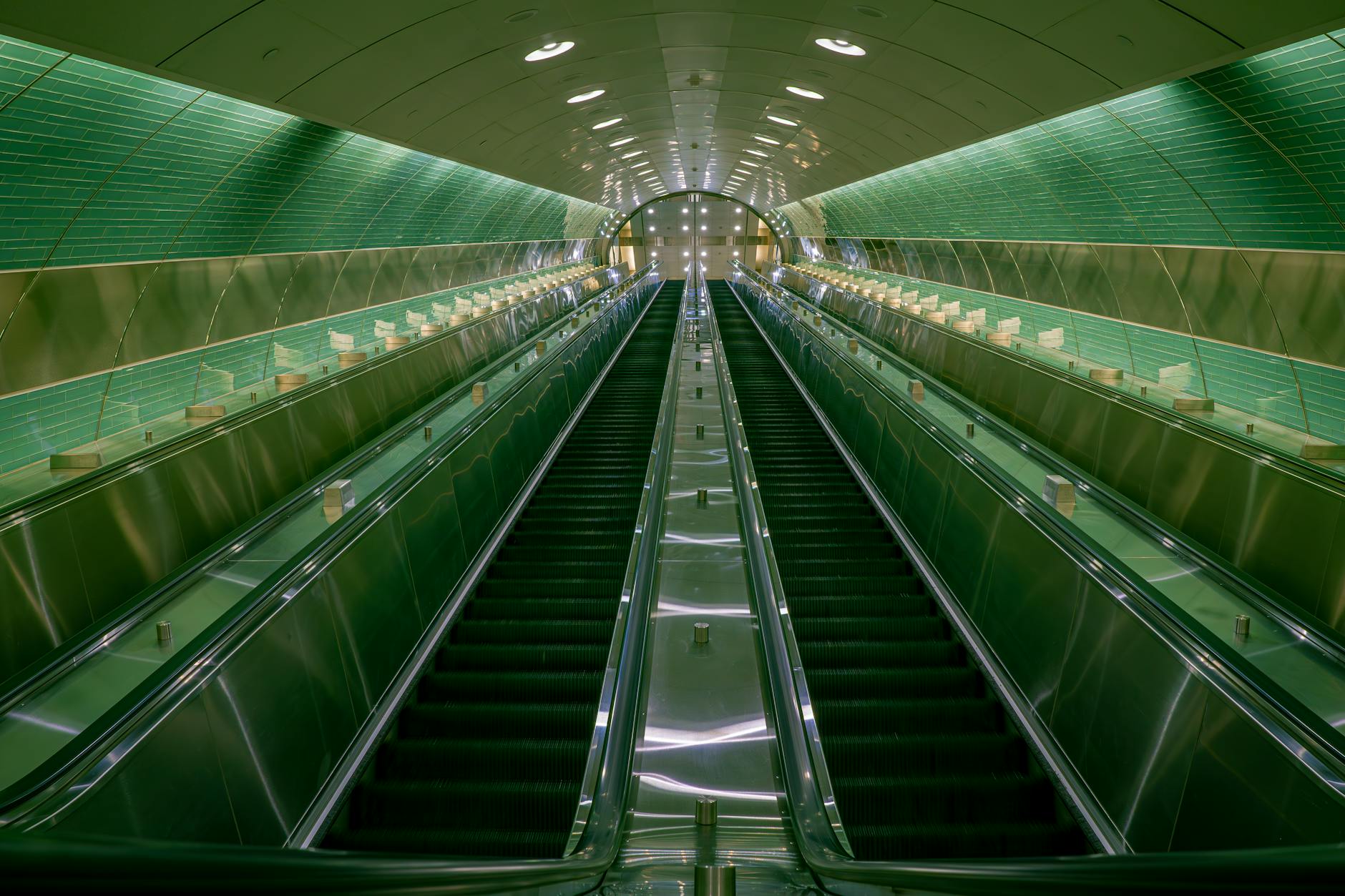looking up at an underground escalator