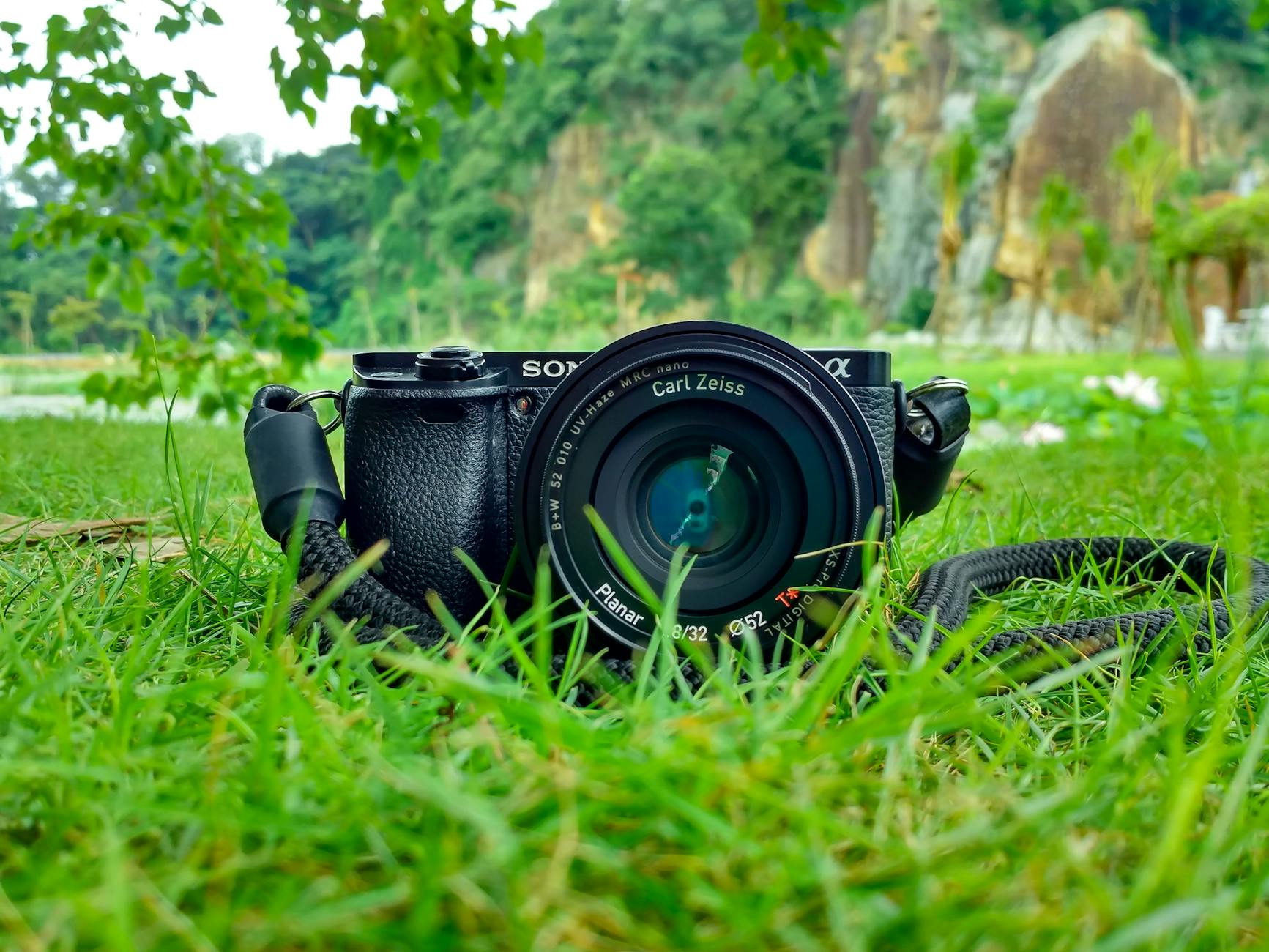 A sony alpha digital camera on grass