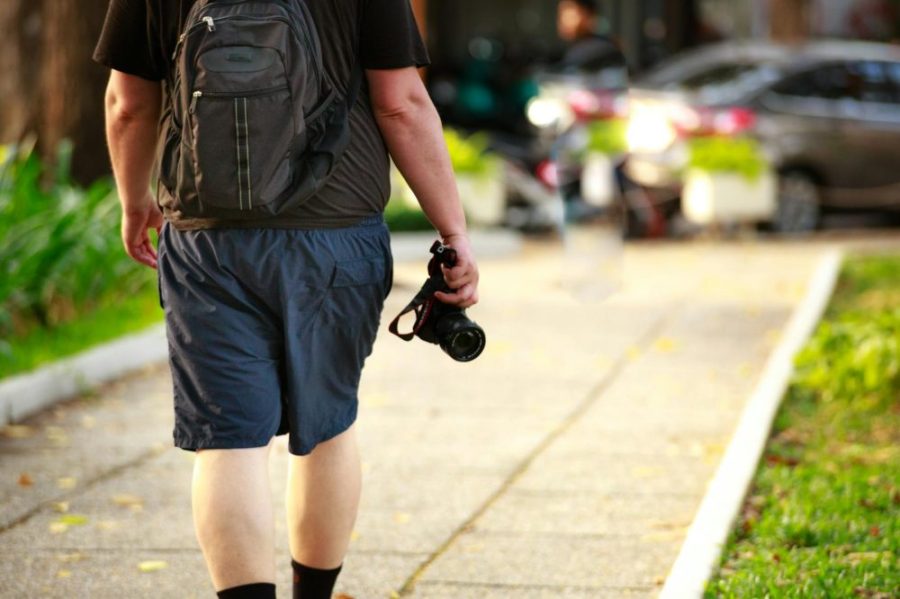man holding black camera